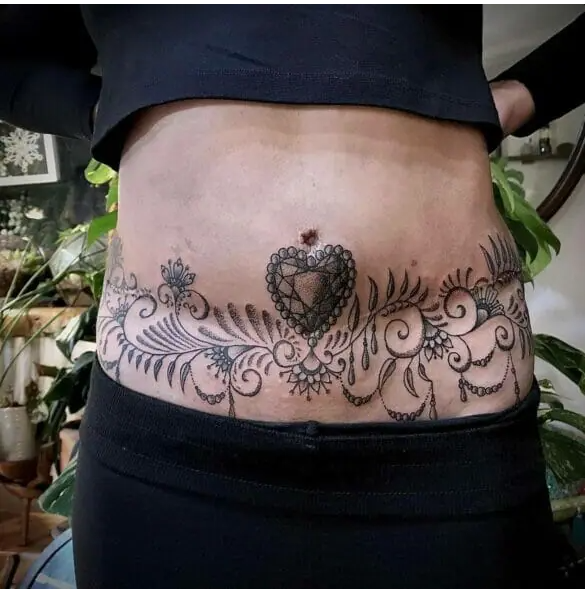 Tummy Tuck Tattoo with a Belly Chain